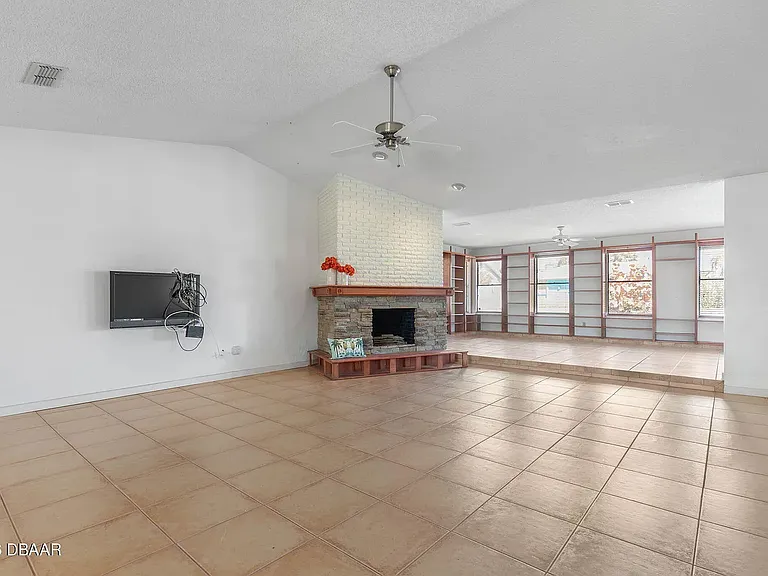 Very large open floor plan, with a wood-burning fireplace.