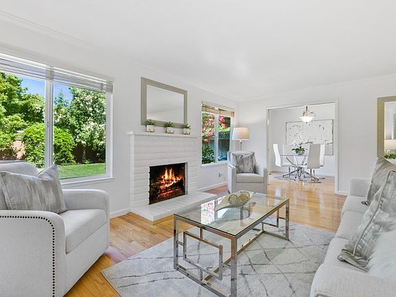 Living Room with Fireplace and Dining room behind