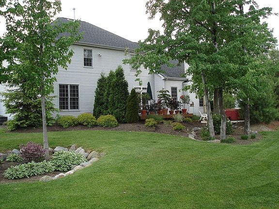 Private backyard with deck, hot tub, and water view!