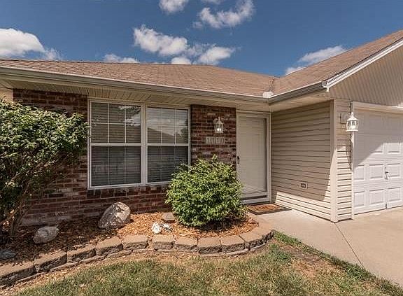 Pretty entry with easy to maintain landscaping!
