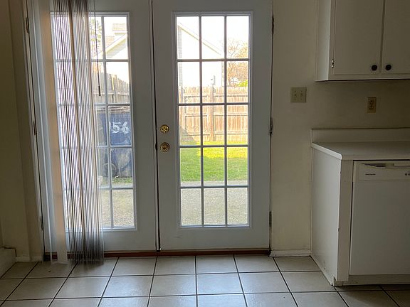 door to fenced back yard