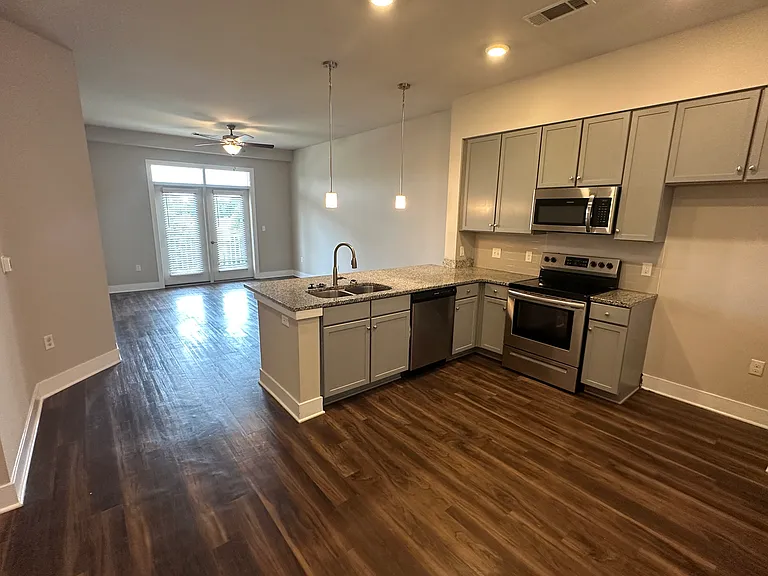 Open floorpan with granite countertops and stainless appliances