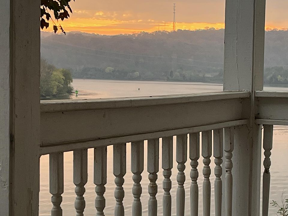 There are (two!) decks facing the river, one upstairs off of the master bedroom, and one down, off of the kitchen.