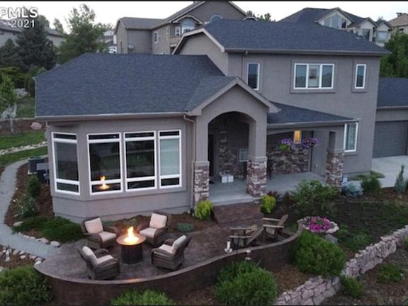 Large South facing entertainment patio with amazing views of city lights and pikes peak