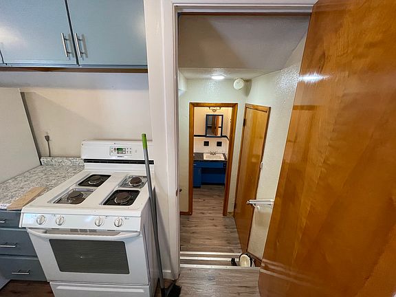 1/2 bath directly off garage door access and kitchen