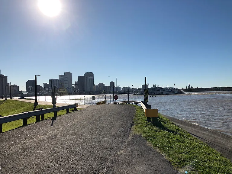 walking, jogging & bicycle paved and lighted path on levee across thhe street from property