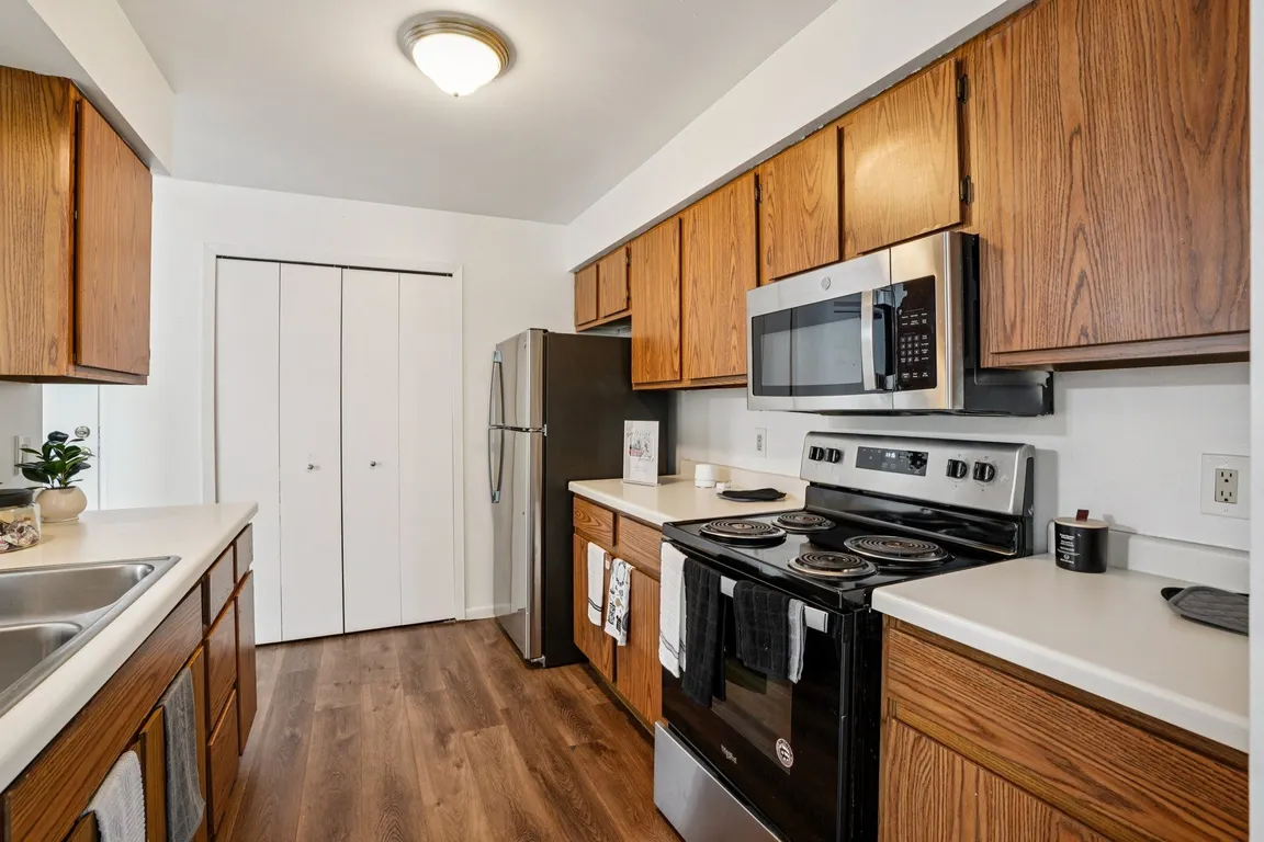 Convenient kitchens feature stainless steel stove top ovens and built-in microwaves, professionally operated by Highlands Vista Group.