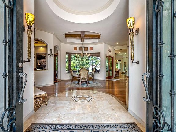 As you enter the Mediterranean style home -you can see right through to the lakefrontâ creating a seamless indoor and outdoor connection.