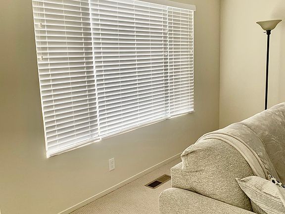 Faux wood blinds.