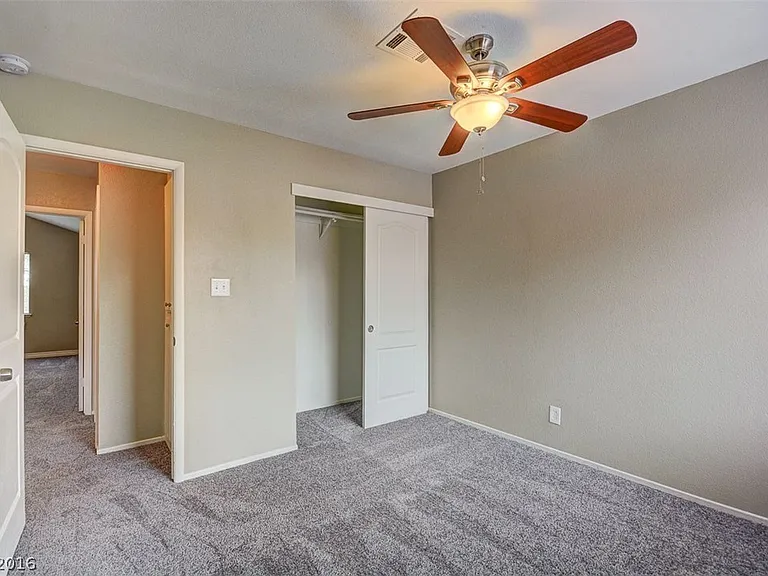 The flooring has been upgraded to laminate_there is no longer any carpet in this room