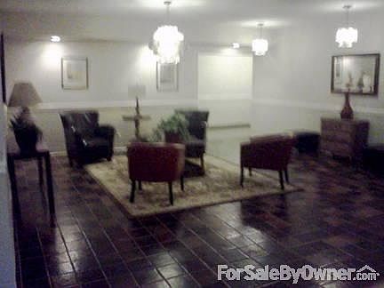 Lobby enterence.
						:
						Lobby with sitting area and elevator.