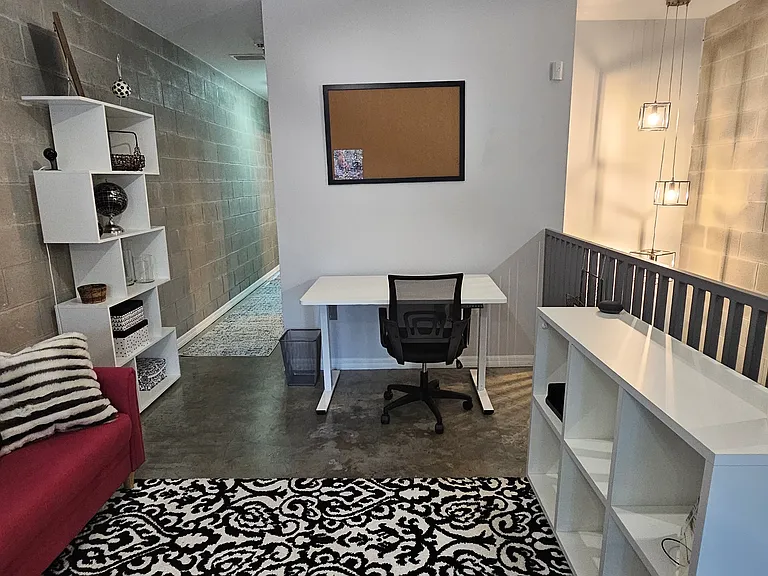 Office space includes an electric standup desk.