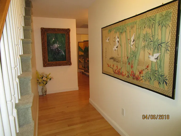 hallway with stairway to third floor family/playroom/library