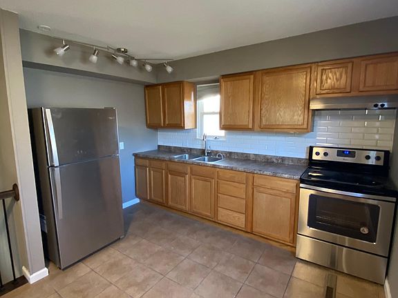Kitchen - stainless steel appliances, new cabinets, updated lighting, backsplash