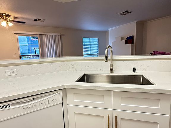 A new sink and faucet make kitchen detailing easy and convenient.