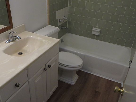 New flooring in tiled bath.