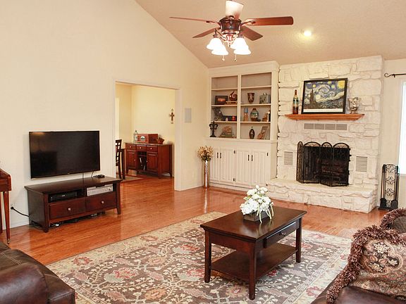 Nice vaulted living area with built-ins