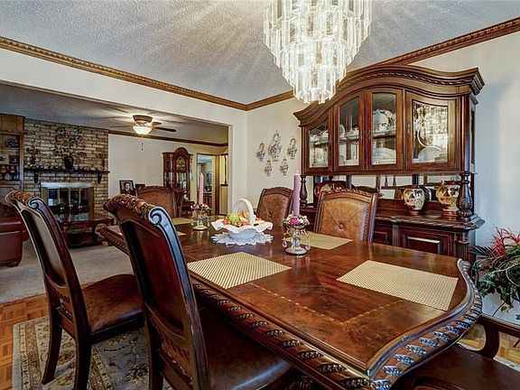 Formal dining room with view of living room.