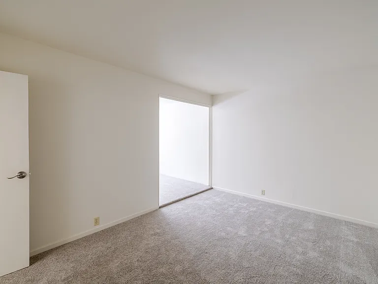 Bedroom C features a spacious layout with a private entry nook, offering a quiet retreat.