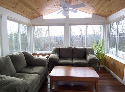 Interior of 4 season porch with mahogany flooring 
