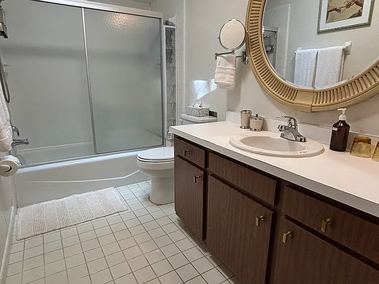 Shared bath with tub/shower combination.