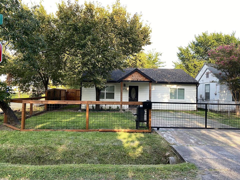 Front yard with automatic gate for 2 cars