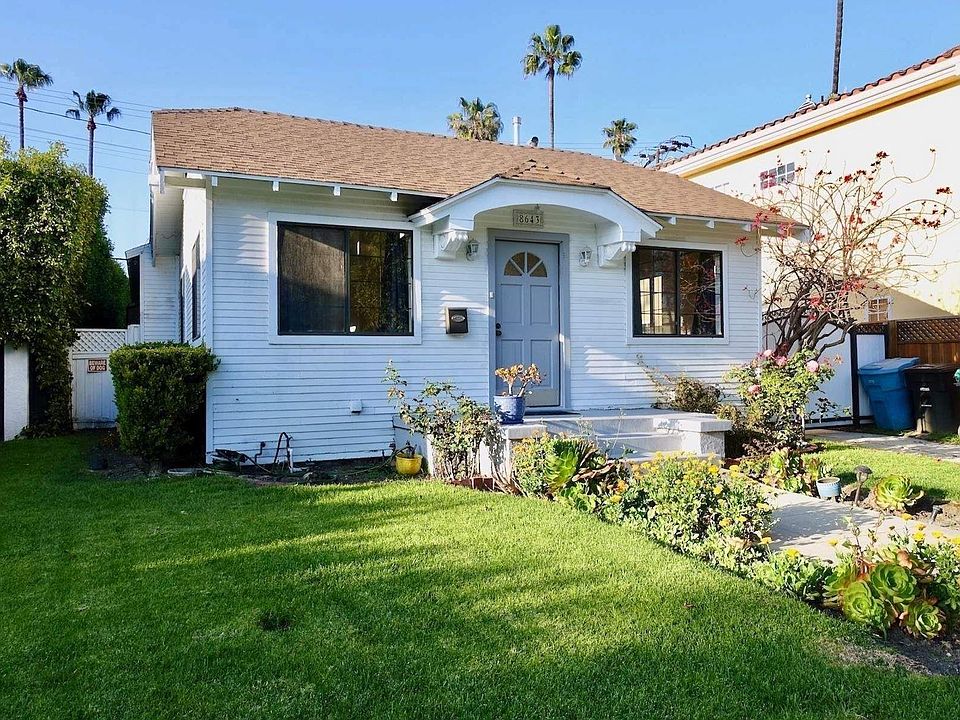 Front exterior with gated driveway