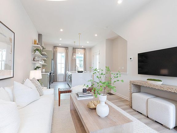 Representative photo - 2nd floor open concept kitchen, dining & living area with access to covered porch