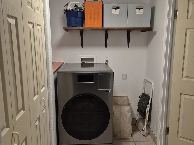 Dedicated laundry room with smart washer / dryer combo and closet for extra storage