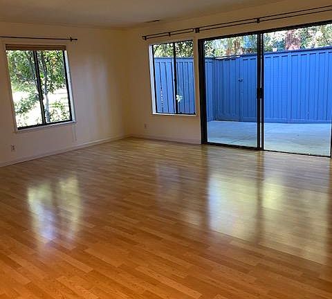 Living room looks out onto private patio