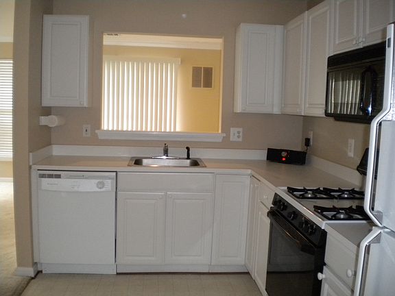 Kitchen with cut-out to dining room