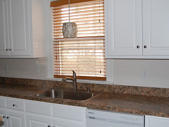Kitchen view sink & window.
						:
						Lots of Counter space, new cabinets, & large single sink.