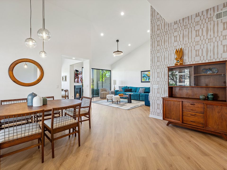 Open floor space featuring Dining Room, Living Room, and Bar
