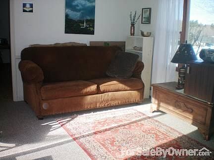 Den w/slider to back yard [no deck]
						:
						Just inside side door entrance off of small entry deck; new[er] carpet