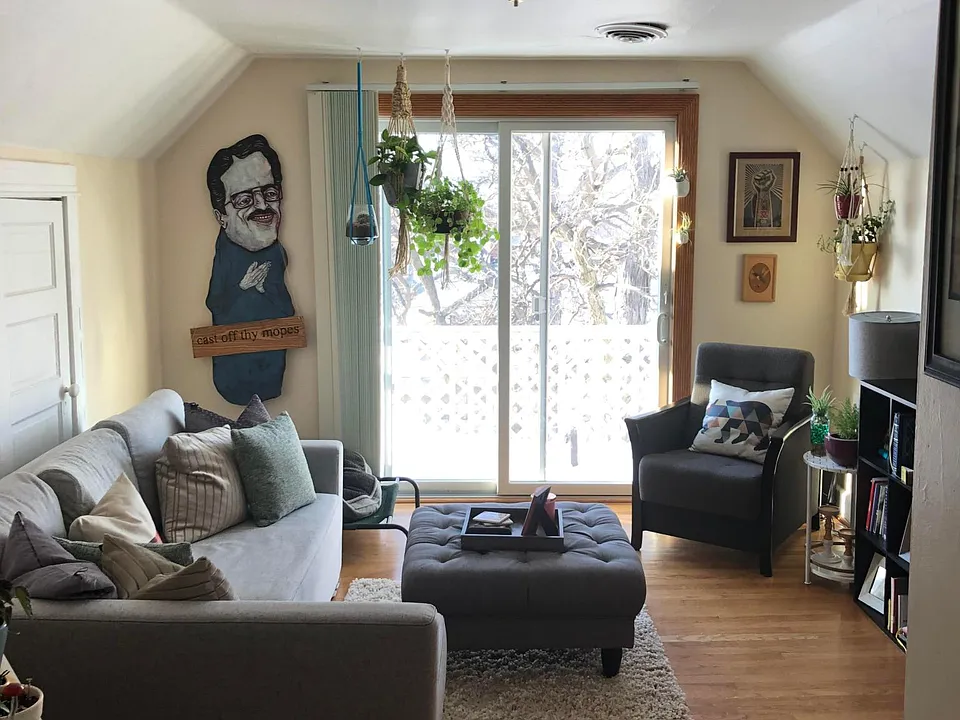 view from hallway toward lving room and entrance to porch through patio doors