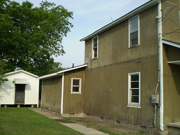 side view with storage shed