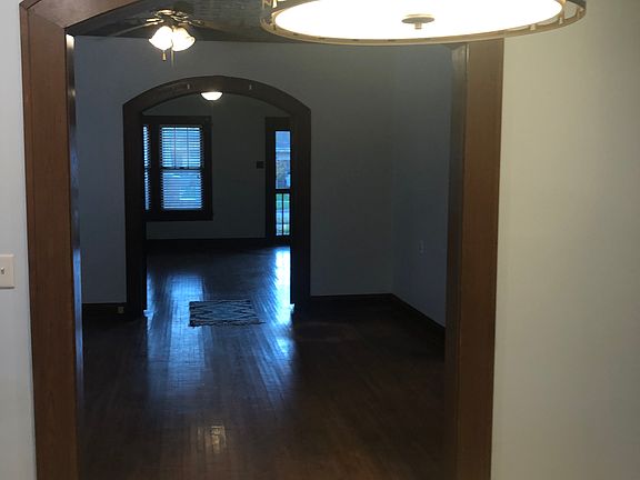 View to front door through the dining area from the kitchen bar.
