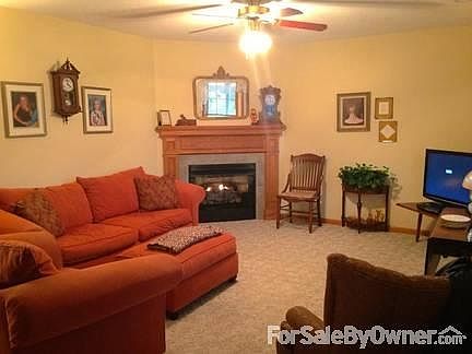 Living Room with Fireplace
						:
						Step inside entrance to the living room with fireplace with gas logs.