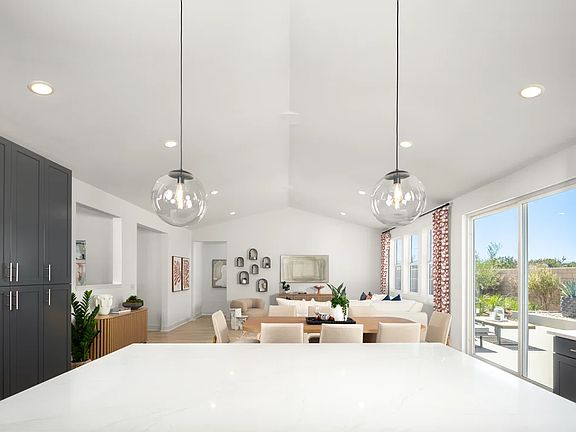 Kitchen with pendant lighting overlooking the great room