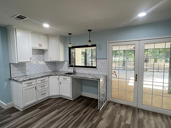 breakfast area with its own mini sink and extra cabinets.