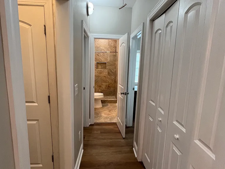 Hallway from Living Room to Bathroom and Two Bedrooms