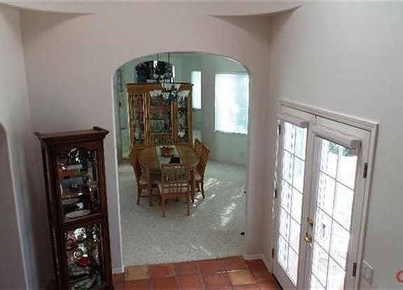 Looking from front entry landing down towards the formal dining room.