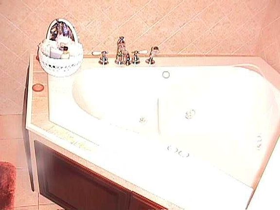 jetted oversized tub in tile bath