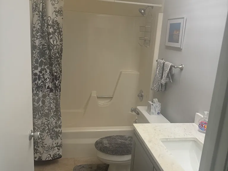 Second bathroom with tub.