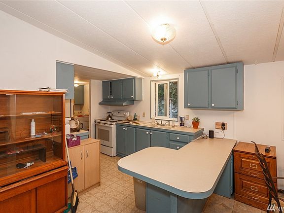 Convenient kitchen with breakfast bar.