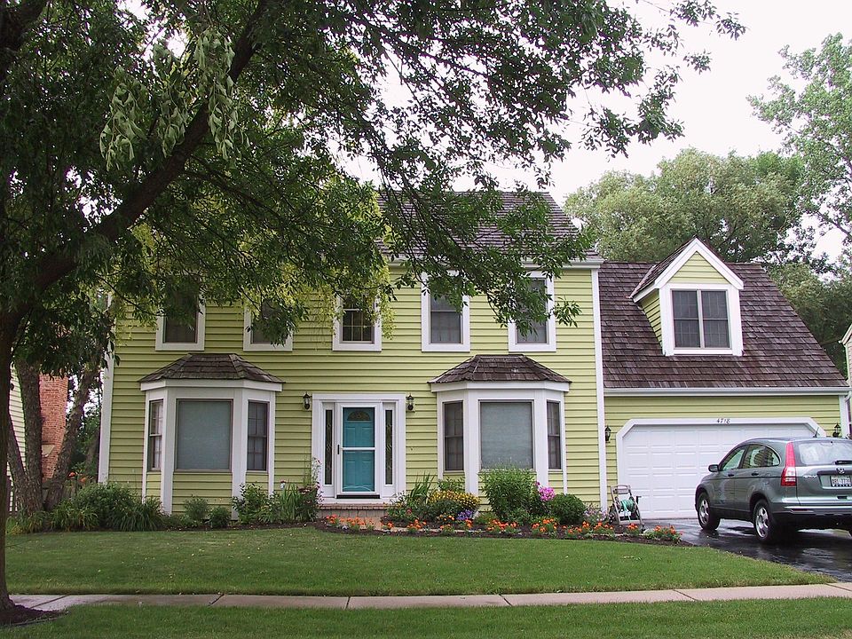 Front Elevation Featuring Cedar Shake Roof, 2 Car Att Garage & Cedar Siding