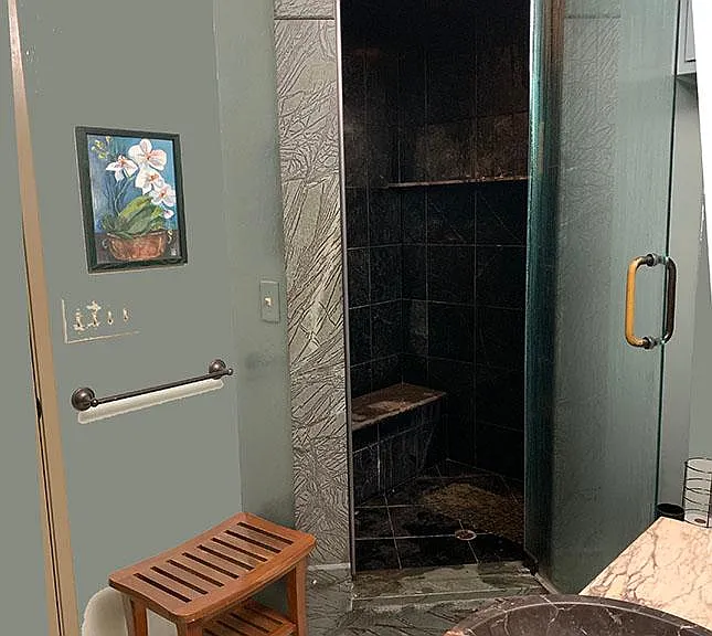 Steam room, marble sink, washer/dryer, doors to 2nd bedroom and 3rd bedroom
