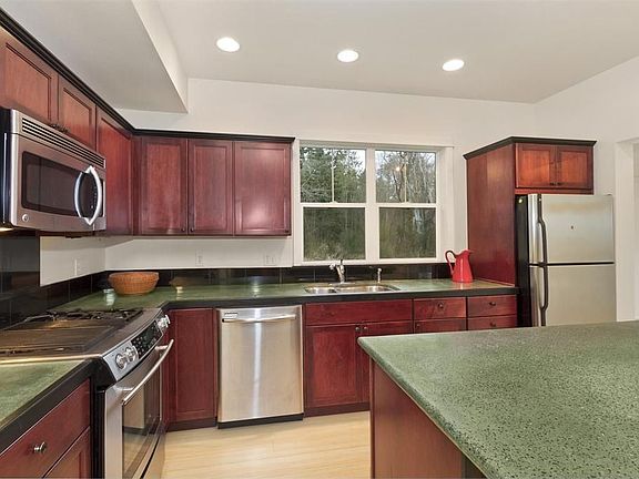 Cherry cabinets and stainless appliances)