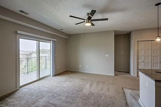 Sliding glass doors for balcony entrance in a unit at Avenue 204.