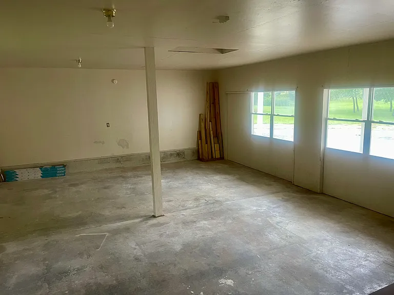 STORAGE AREA THAT WILL BE PUT DOORS IN FOR GARAGE IN SUMMER.